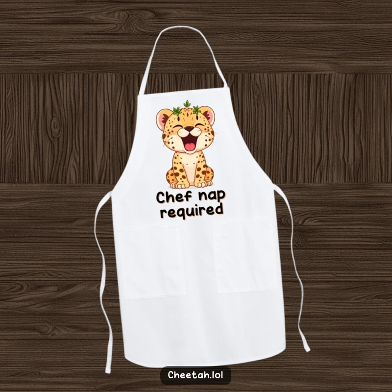 Funny Cheetah Cub Apron: A small crowned cheetah cub yawns widely, ready to oversee the kitchen with sleepy, victorious authority.