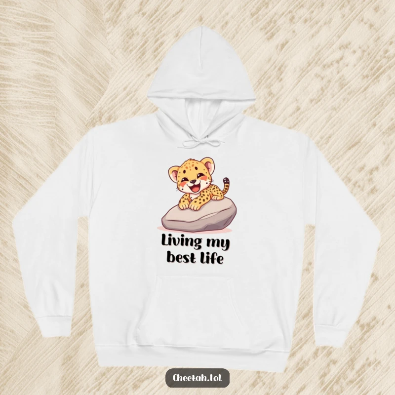 Funny hoodie illustrating a cheetah cub joyfully sliding down a smooth rock, complete with a happy yelp, embodying pure exhilaration.