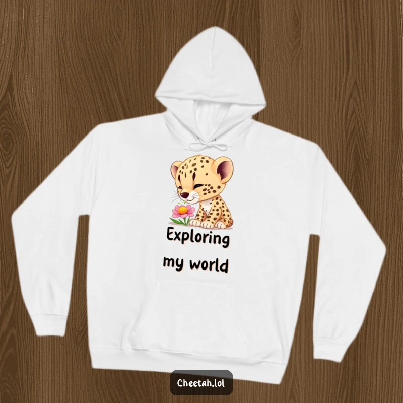Funny cheetah cub wonder hoodie featuring a curious cub smelling a flower, perfect for cozy, humorous appreciation of nature.