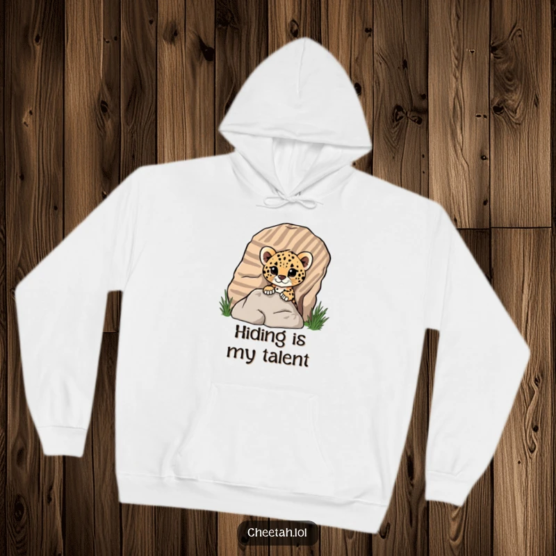 Funny cheetah cub peeking out from behind a rock on a cozy hoodie, perfect for screen reader users to imagine a cute surprise.