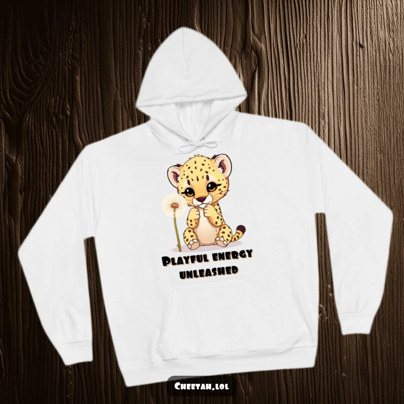 Funny hoodie depicting a cheetah cub playfully interacting with a dandelion, offering warmth and adorable charm.