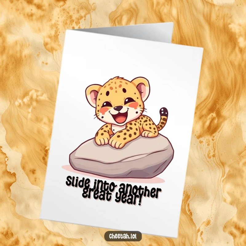 Funny Free Printable Birthday Card: Cheetah cub joyfully sliding down a rock, a wild celebration of another year.