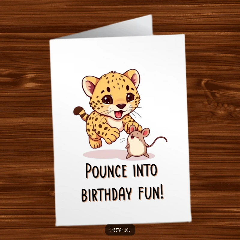Funny Free Printable Birthday Card: An excited cheetah cub playfully pouncing on a bouncing toy mouse, embodying pure joy.