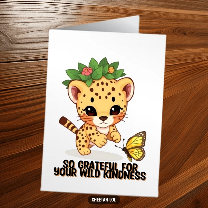 Funny Free Printable Thank You Card: A cheetah cub wearing a leaf crown playfully pounces on a butterfly, showing thanks.