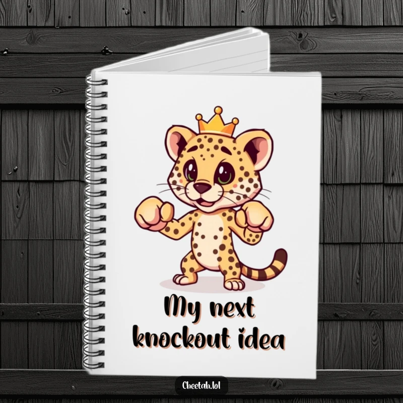 A funny notebook featuring a cheetah in a boxing stance and wearing a crown, perfect for jotting down notes.