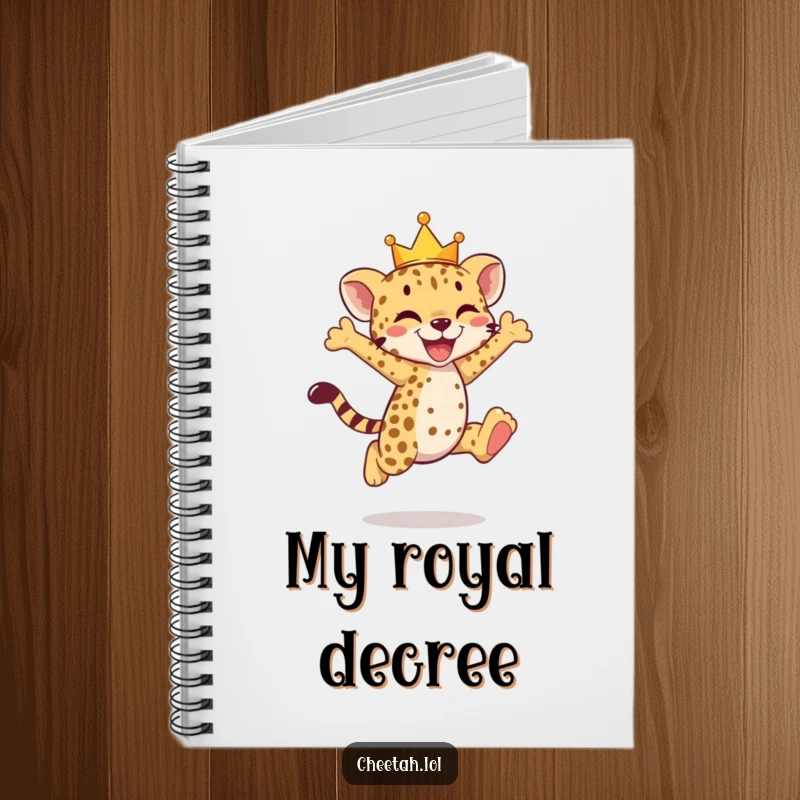 Funny cheetah cub notebook with a crowned cub mid-joyful leap, inspiring grand ideas.