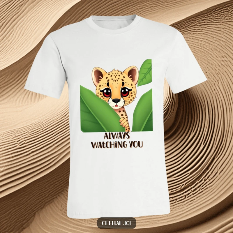 Funny t-shirt graphic of a cheetah with big, curious eyes peeking from behind a large spotted leaf, creating a playful and humorous design.