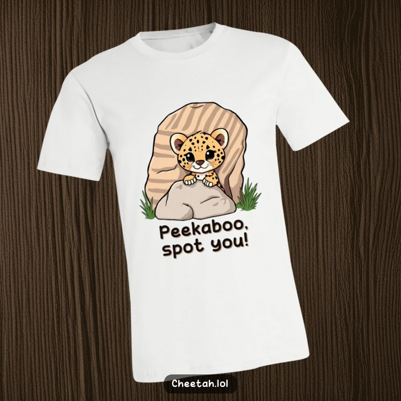 Funny cheetah cub peeking from behind a striped rock on a t-shirt, showing playful mischief for screen reader users.