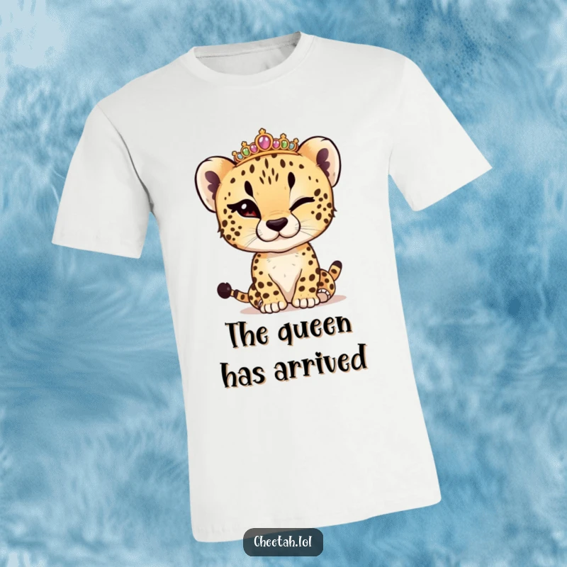Funny cheetah cub winking while adjusting a tiny tiara, depicted on a soft t-shirt, embodying playful royalty.