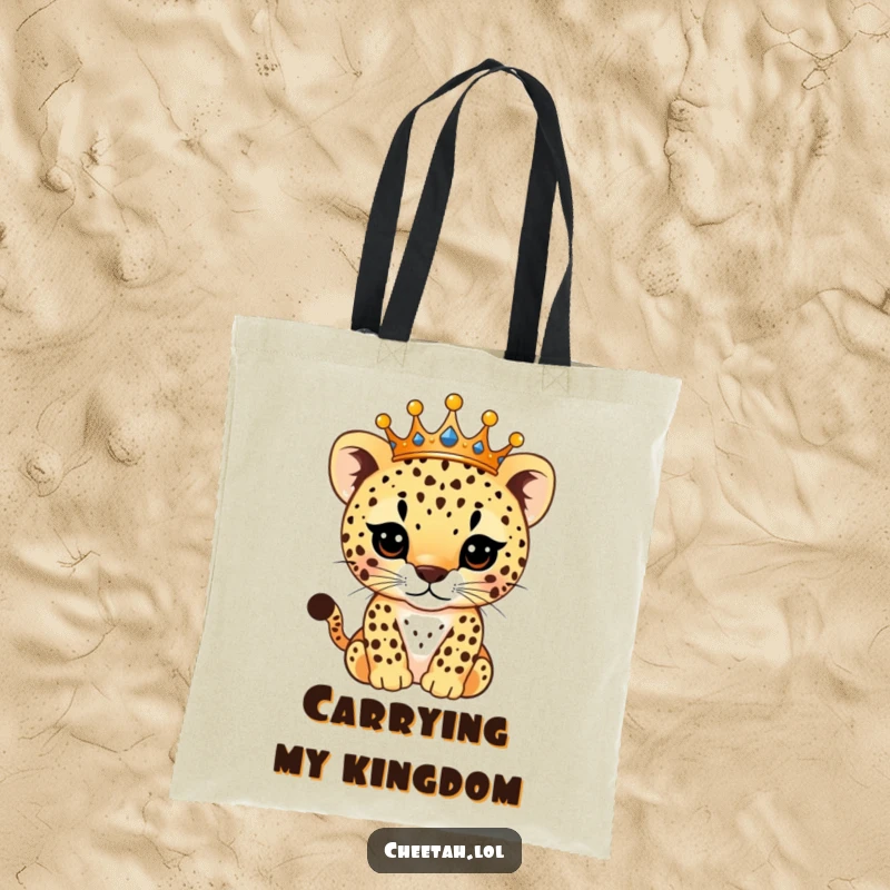 Funny Tote Bag showcasing a sophisticated cheetah cub wearing a radiant crown, with its spots sparkling, perfect for stylish and humorous errands.
