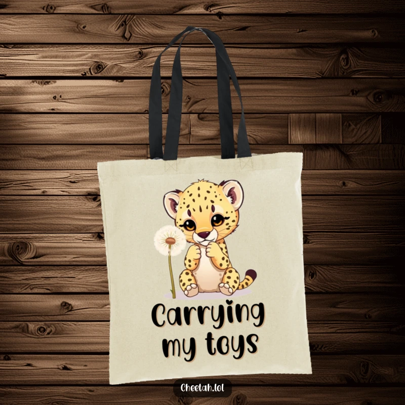 Funny tote bag showing a cheetah cub playfully batting at a dandelion, ideal for carrying items with cute animal flair.