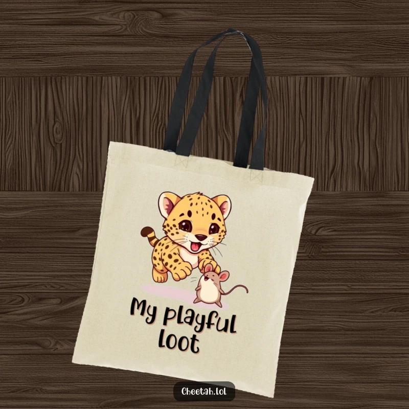 Funny cheetah cub excitedly pouncing on a bouncing toy mouse on a tote bag, ideal for shoppers.